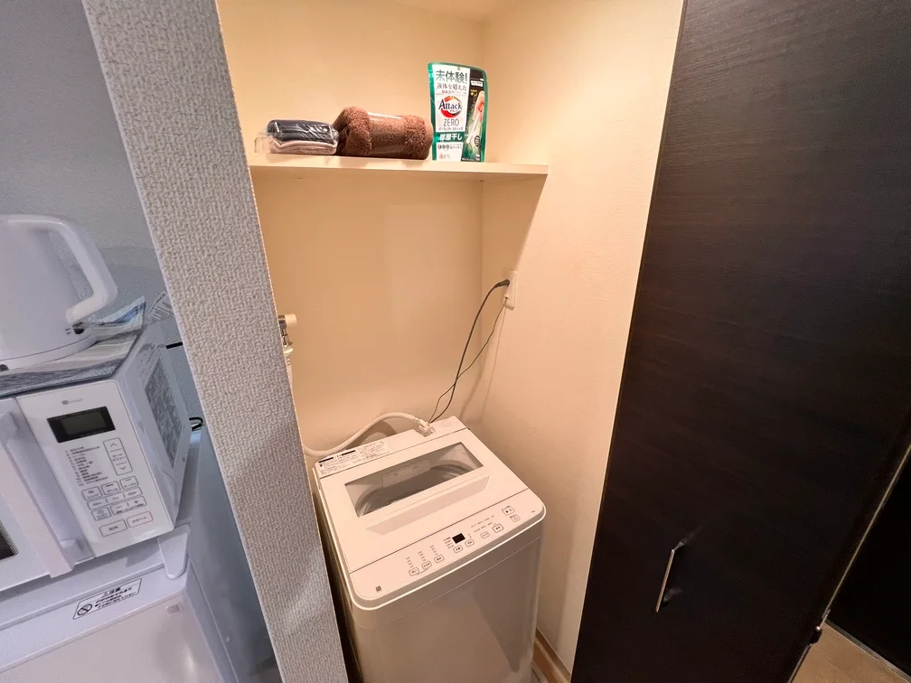 収納式の洗濯機スペースで夜間でも安心