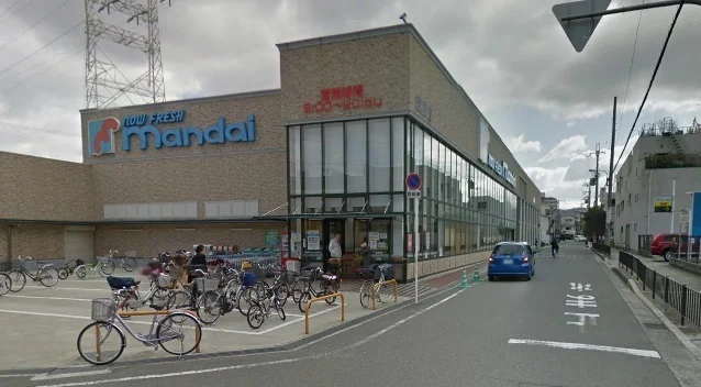 万代萱島店様まで1000m