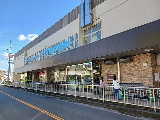 万代寝屋川西店様まで550m