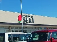 ドラッグストアセキ久喜吉羽店まで1200m