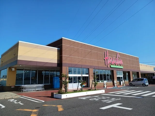 原信　巻店まで418m
