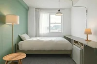 【ベーシック居室】グリーンのアクセントクロスで落ちつく空間