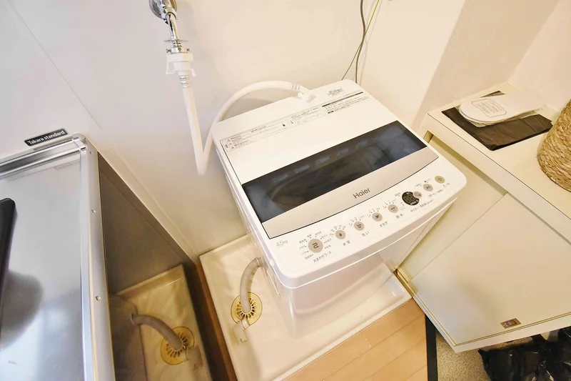 【洗濯機画像】ホテルと違い洗濯機がある生活は良いですね♪7日以上の利用なら富山県富山市ウィークリーマンションをご利用下さい★洗濯洗剤も完備‼