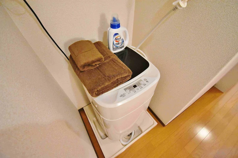 【洗濯機画像】ホテルと違い洗濯機がある生活は良いですね♪7日以上の利用なら滋賀長浜市ウィークリーマンションをご利用下さい★洗濯洗剤も完備‼